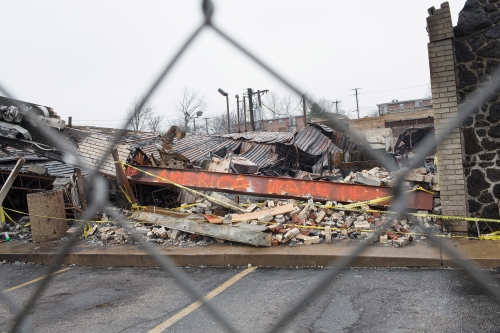 FERGUSON, MO - MARCH 13:  A fence surrounds the burned rubble of a strip mall on March 13, 2015 in Ferguson, Missouri. The mall was looted and set on fire in November when rioting broke out after residents learned that the police officer responsible for the killing of Michael Brown would not be charged with any crime. Few of the businesses destroyed in the rioting in Ferguson and nearby Dellwood have reopened. Two police officers were shot Wednesday while standing outside the Ferguson police station observing a protest. Ferguson has faced many violent protests since the August death of Michael Brown.  (Photo by Scott Olson/Getty Images)